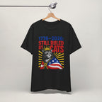 Flat lay of white graphic cat t-shirt with Still Ruled By Cats patriotic design