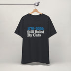Flat lay of vintage black graphic cat t-shirt with Ruled By Cats patriotic design