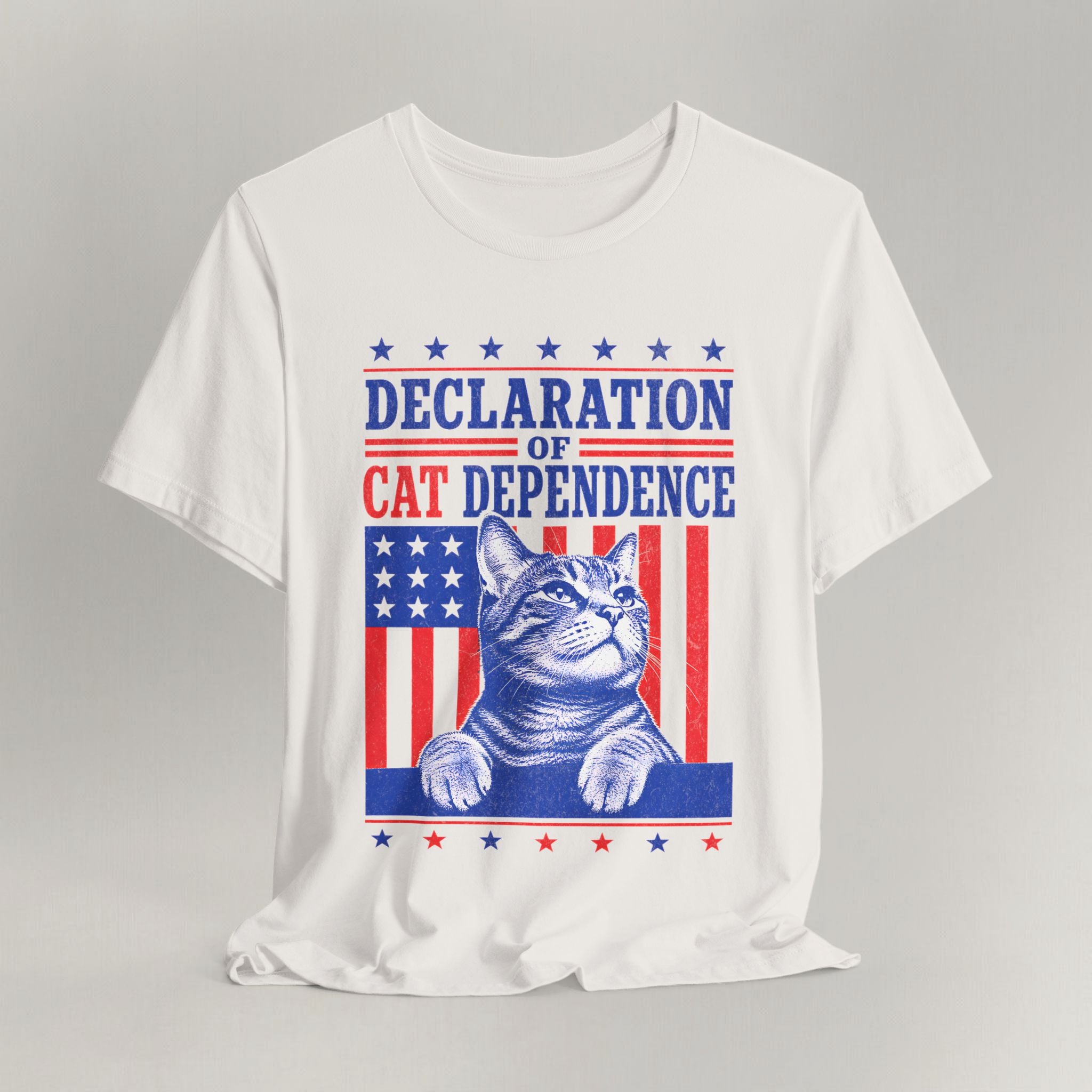 Flat lay of vintage white graphic cat t-shirt with Cat Dependence Day design