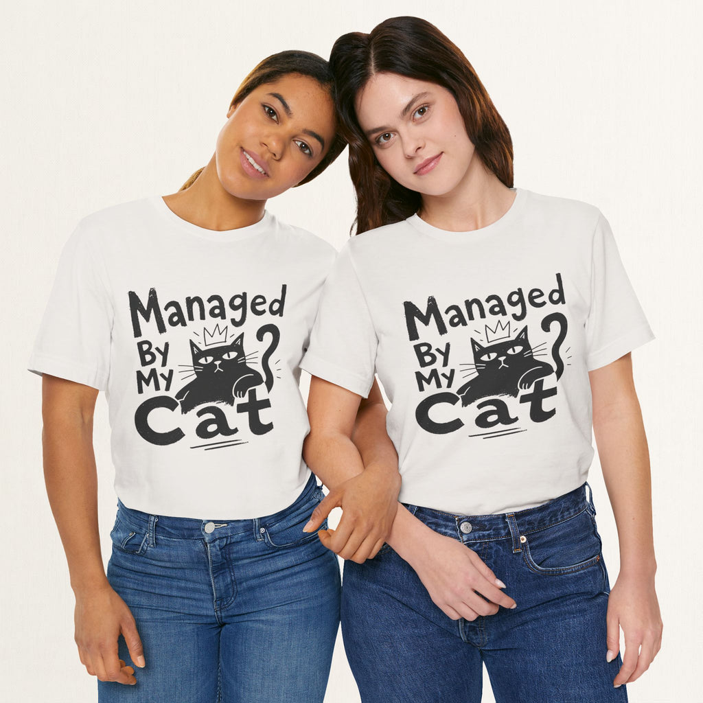 Two women wearing vintage white Managed By My Cat graphic t-shirts with paw icon