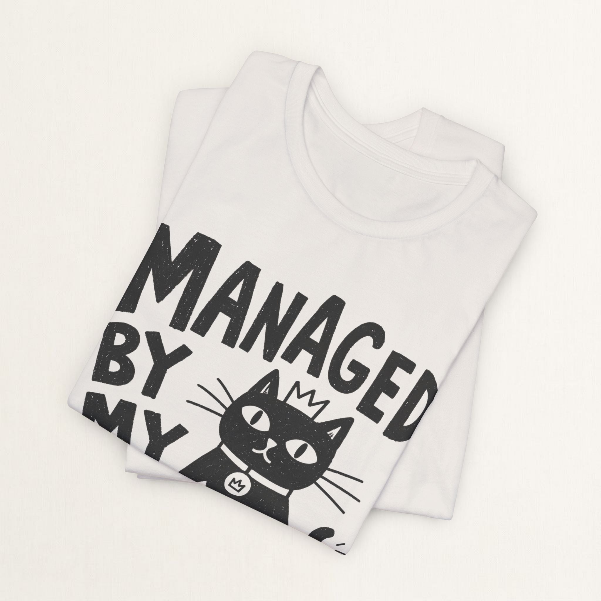 Folded vintage white Managed By My Cat t-shirt with printed text