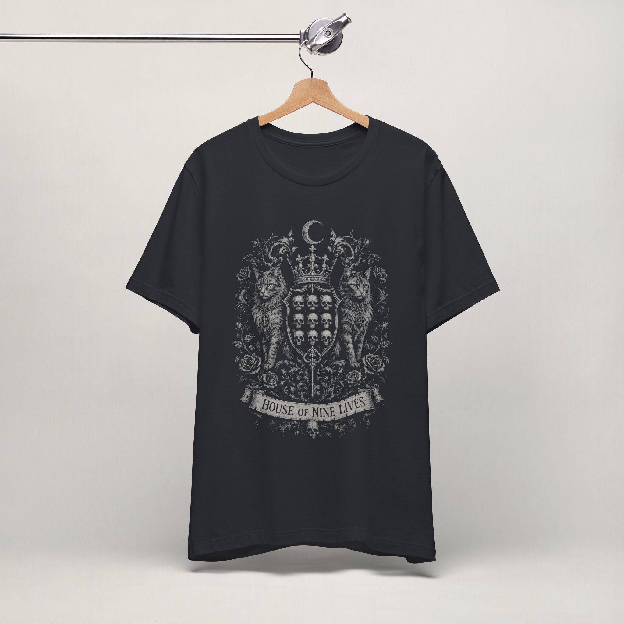 Vintage black House of Nine Lives gothic cat t-shirt on a hanger