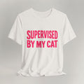Vintage white t-shirt with bold pink Supervised By My Cat graphic and comic-style star bursts