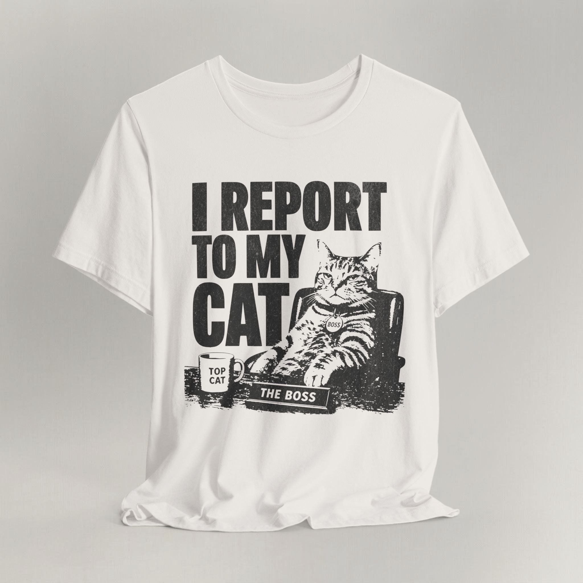 Vintage white graphic cat t-shirt with I Report To My Cat print, flat lay front view