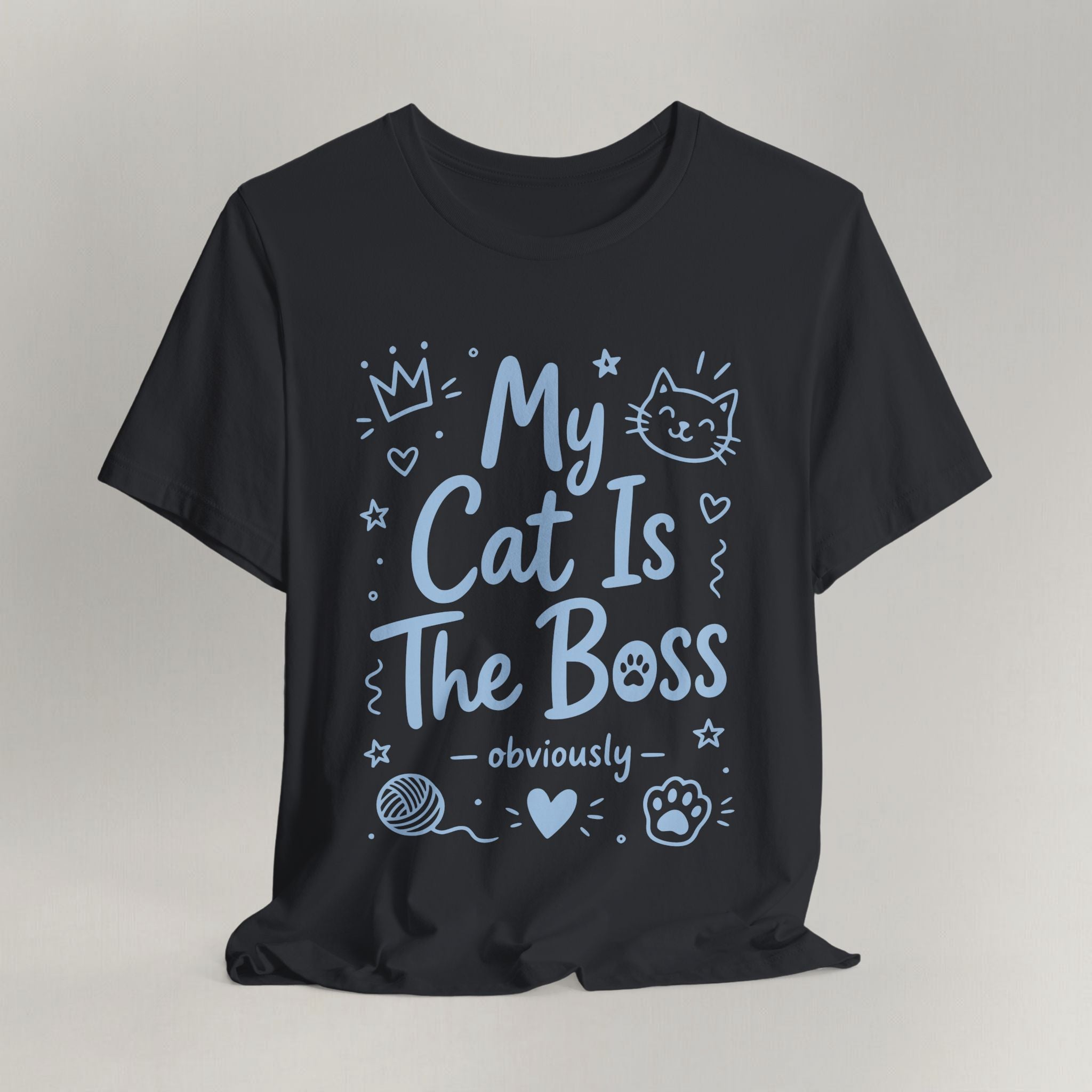 Flat lay of vintage black graphic cat t-shirt with The Boss Obviously print design