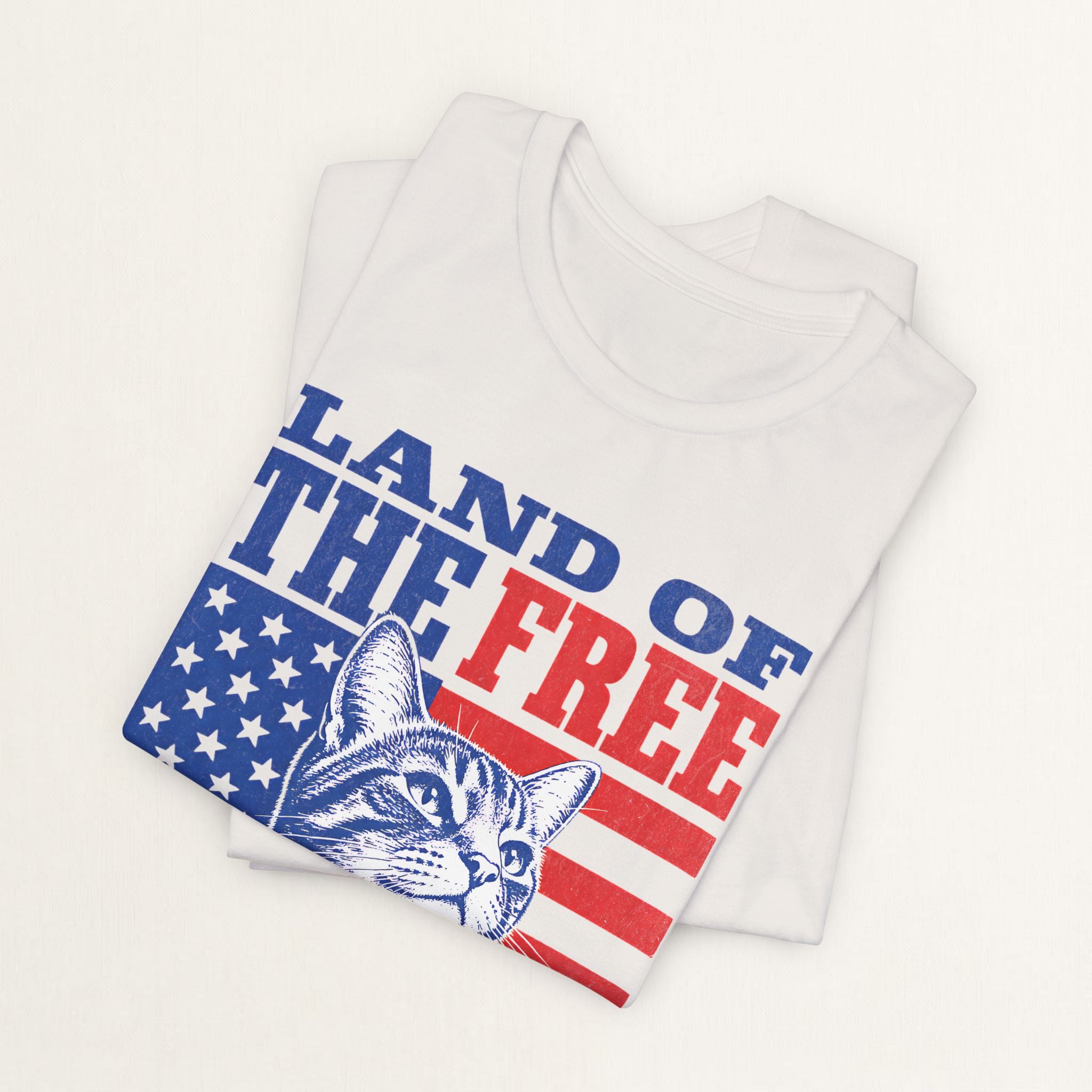 Back view of vintage white Land of the Free cat t-shirt on model