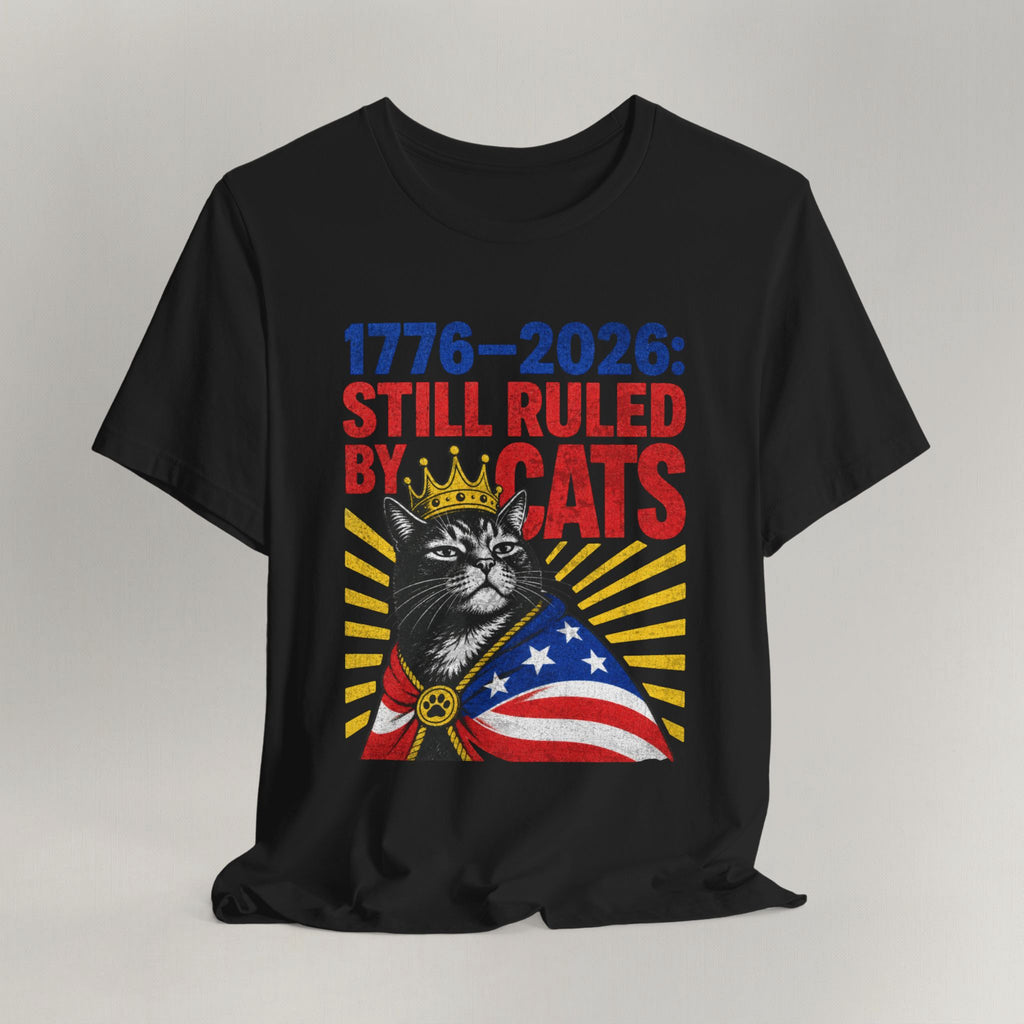 Flat lay of black graphic cat t-shirt with Still Ruled By Cats patriotic design