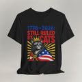 Flat lay of black graphic cat t-shirt with Still Ruled By Cats patriotic design