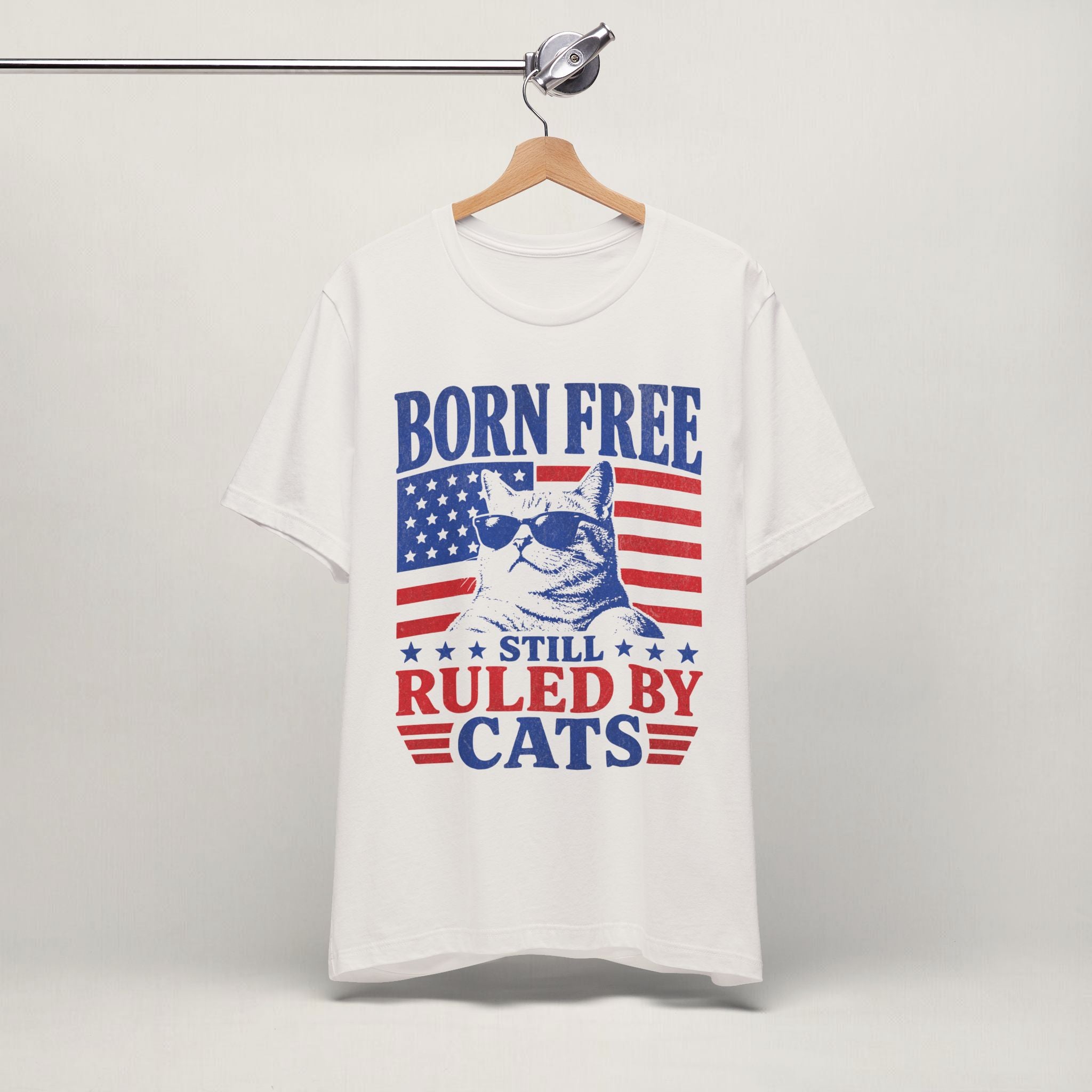 Close-up of Still Ruled By Cats print on vintage white unisex t-shirt