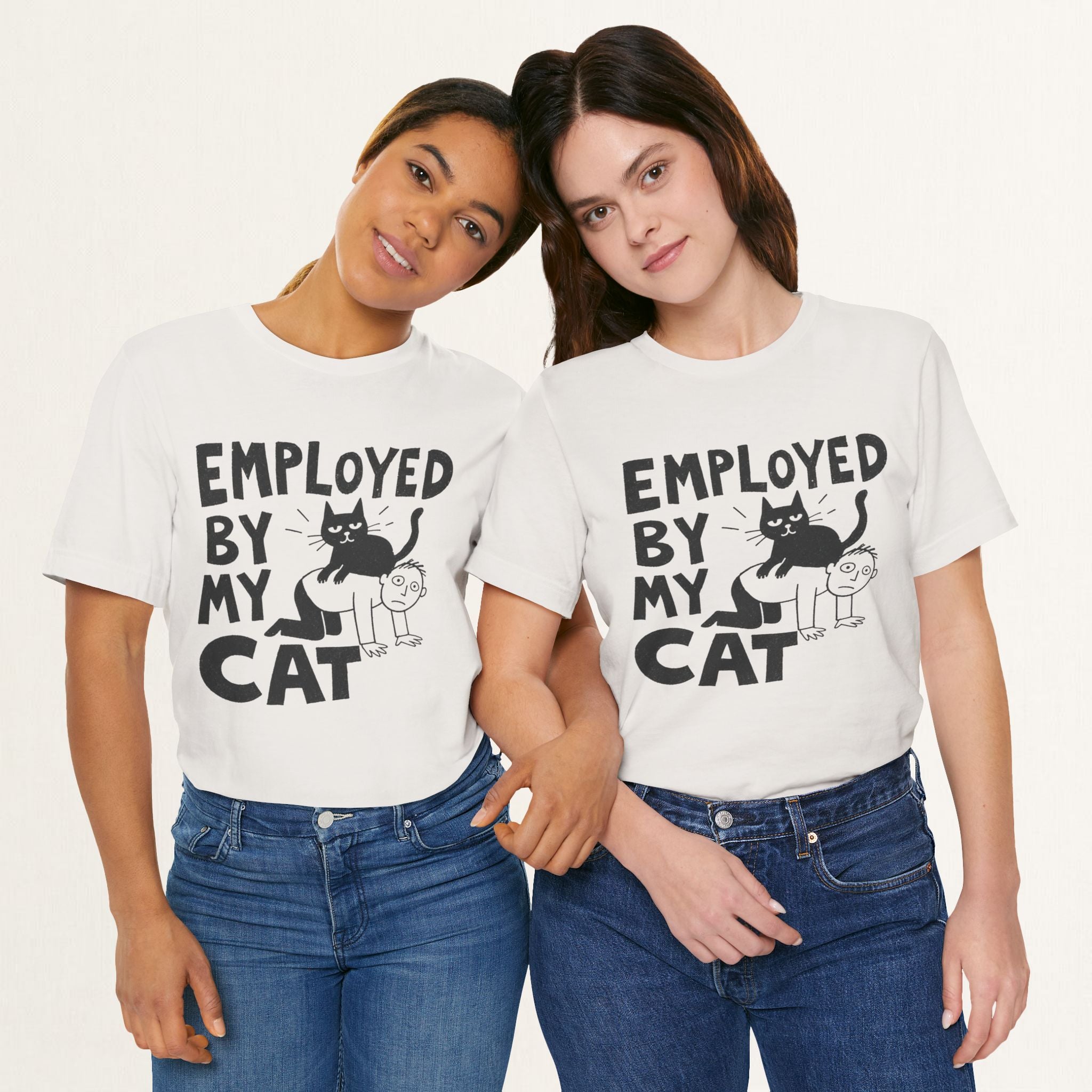 Styled flat lay of vintage white Employed By My Cat graphic tee