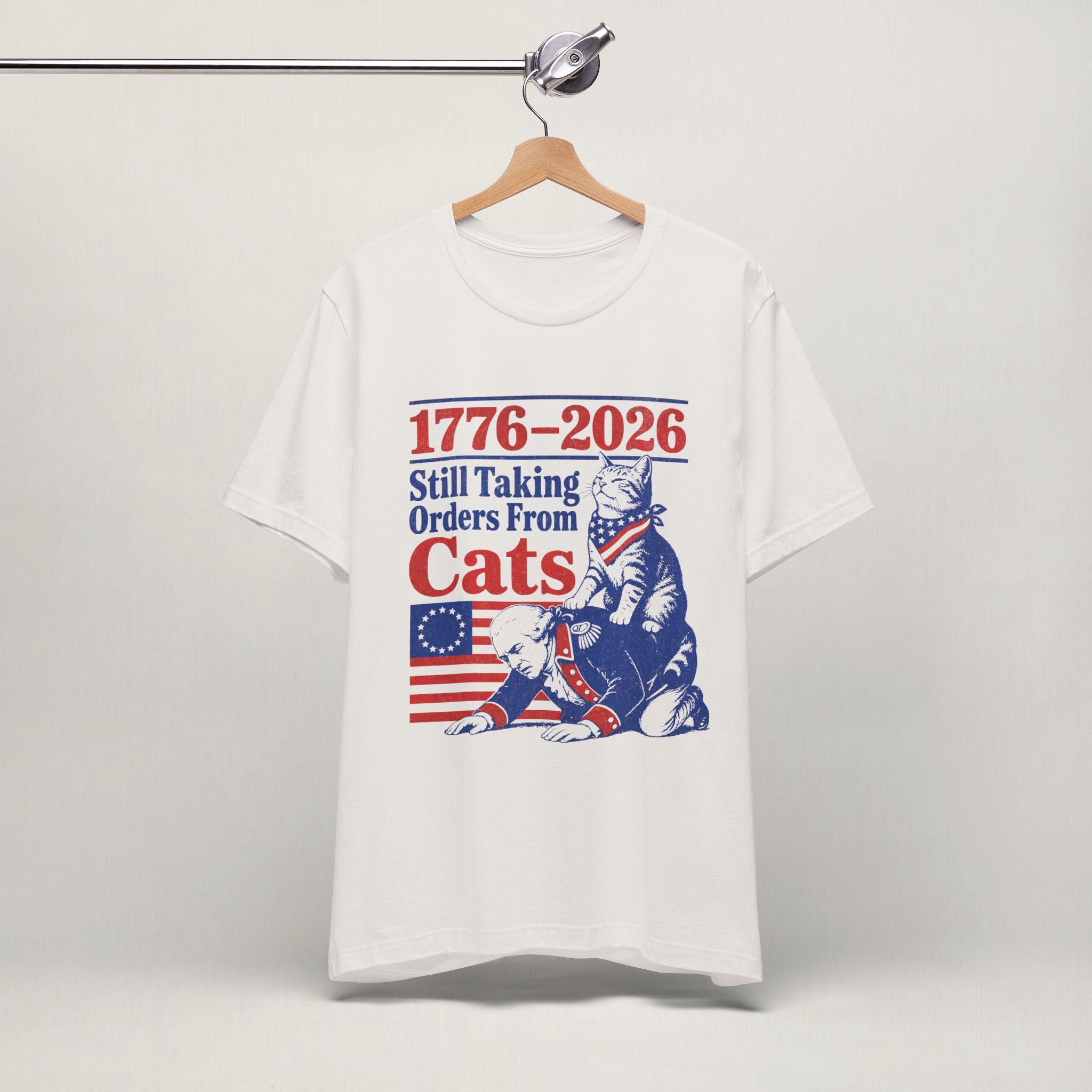 Close-up of Still Taking Orders From Cats print on vintage white unisex t-shirt