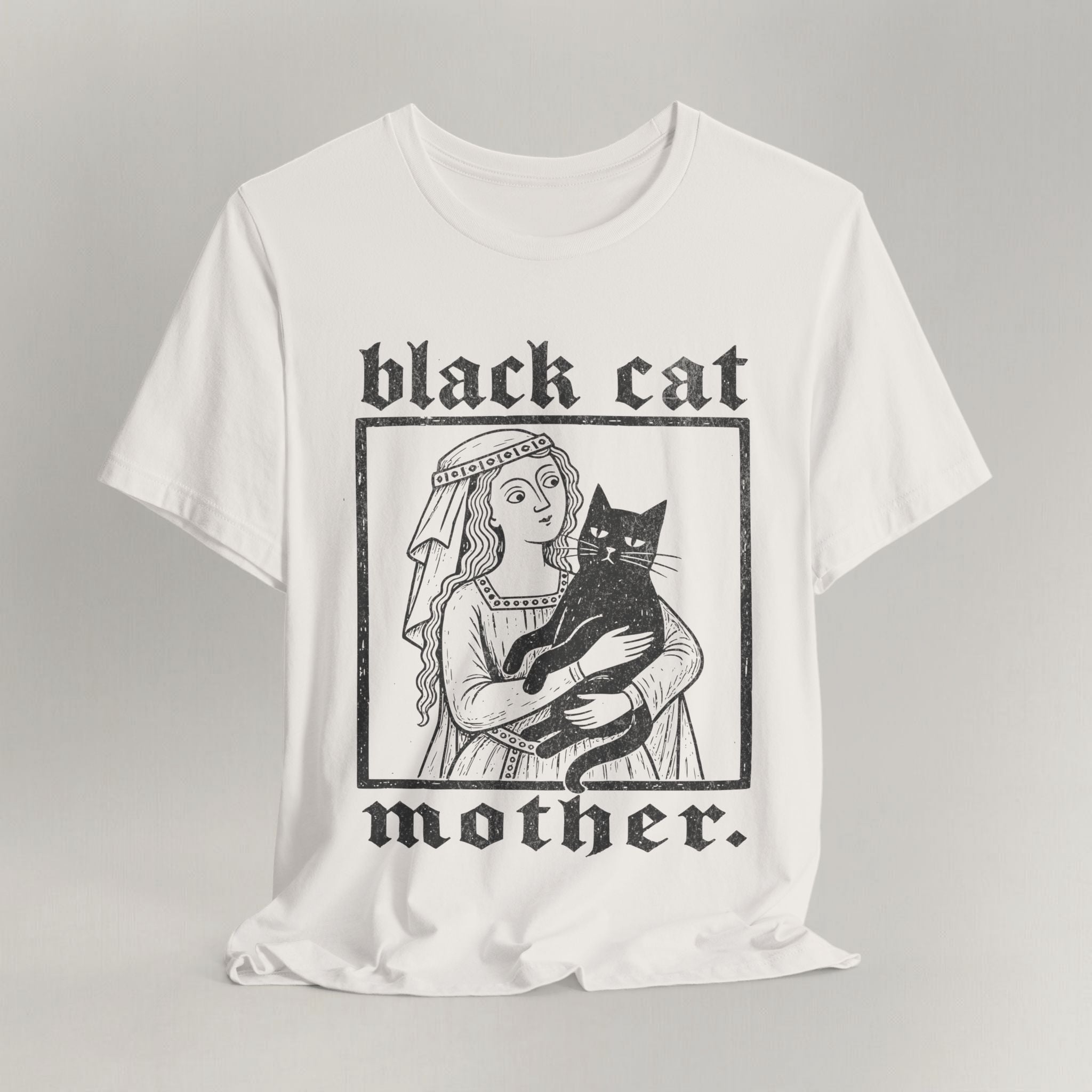 Vintage white cat t-shirt with a Black Cat Mother vintage design of a woman and her black cat, shown flat