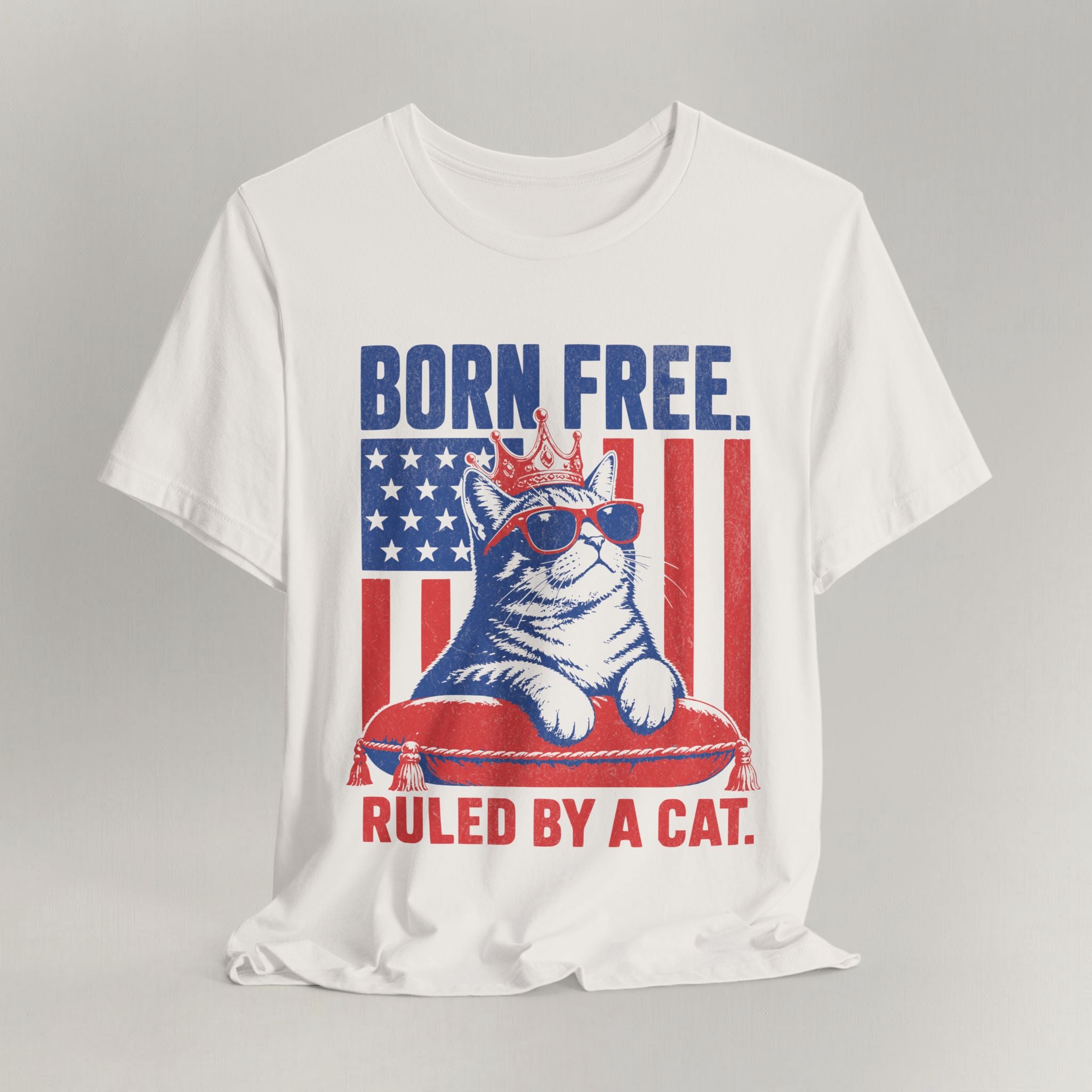 Flat lay of vintage white graphic cat t-shirt with Born Free Ruled By A Cat design
