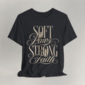 Vintage black cat t-shirt with a Soft Paws, Strong Faith script design, shown flat