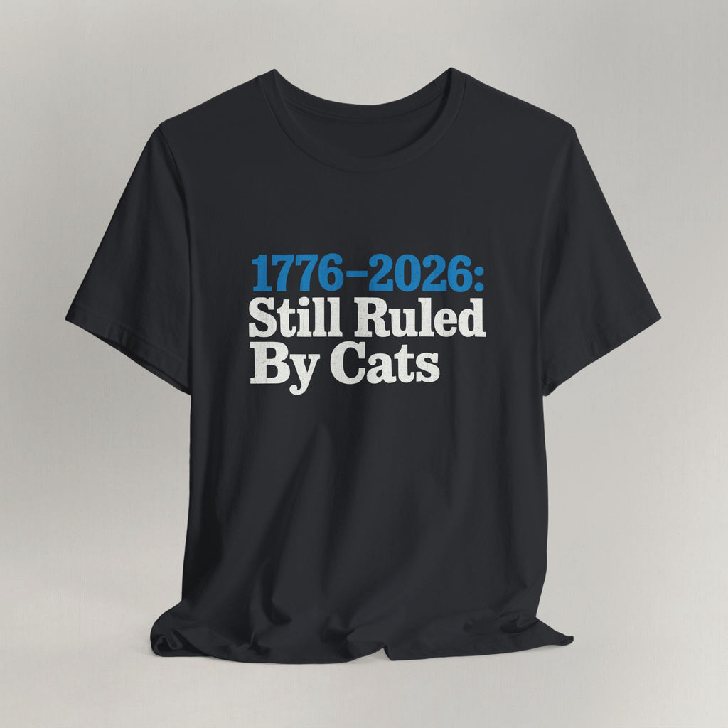 Flat lay of vintage black graphic cat t-shirt with Ruled By Cats patriotic design