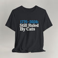 Flat lay of vintage black graphic cat t-shirt with Ruled By Cats patriotic design