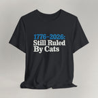 Flat lay of vintage black graphic cat t-shirt with Ruled By Cats patriotic design