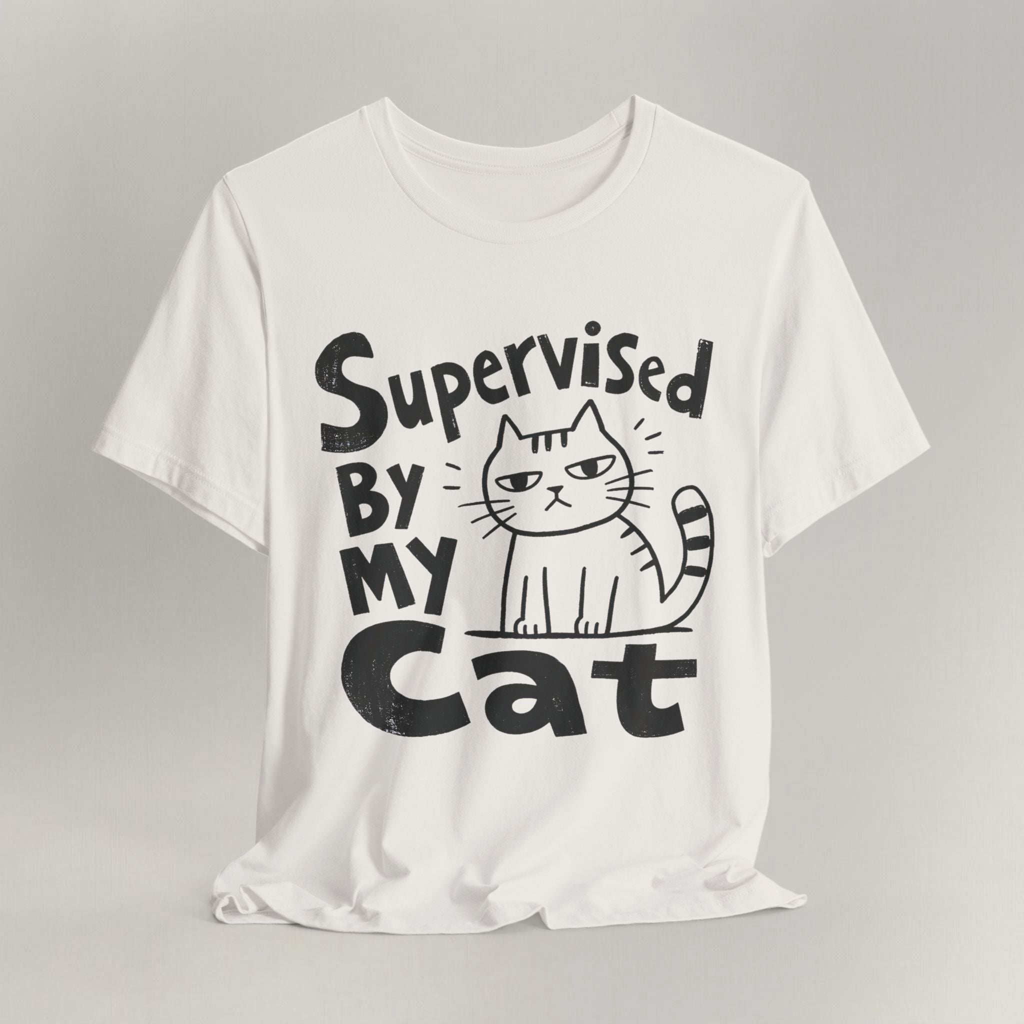 Vintage white t-shirt with hand-drawn Supervised By My Cat design and sketched striped cat