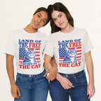 Styled flat lay of vintage white Land of the Free cat graphic tee