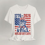 Flat lay of vintage white graphic cat t-shirt with 1776-2026 Ruled By Cats patriotic design