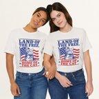 Styled flat lay of vintage white Land of the Free cat graphic tee