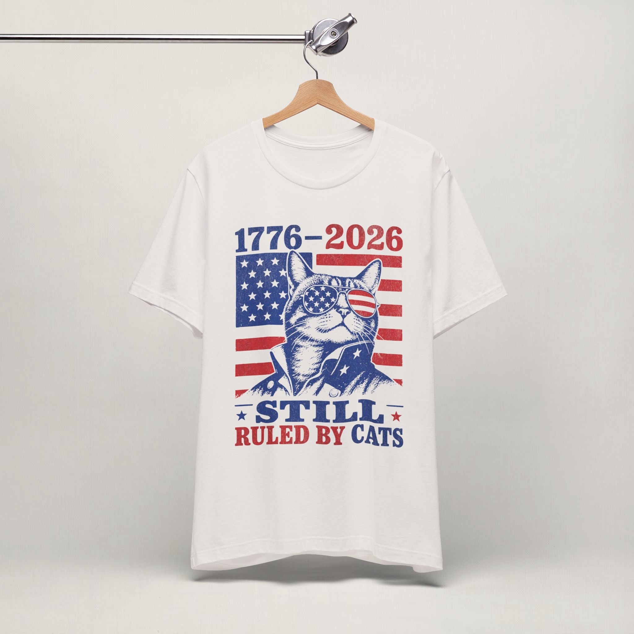 Close-up of Still Ruled By Cats patriotic print on vintage white unisex t-shirt