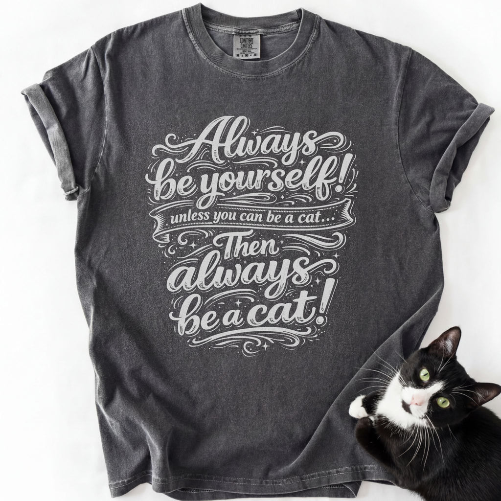 Dark gray garment-dyed cat lover graphic tee with "Always Be a Cat" ornate script design
