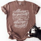 Brown soft-washed cat owner t-shirt with "Always Be a Cat" decorative text print
