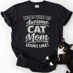 Black cat mom graphic tee with "Awesome Cat Mom" distressed text print — garment-dyed