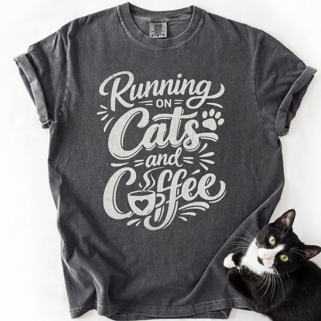 Dark gray cat lover tee with "Running on Cats and Coffee" graphic print — garment-dyed