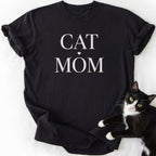 Black proud cat mom shirt with "Cat Mom" serif lettering and heart design — relaxed fit