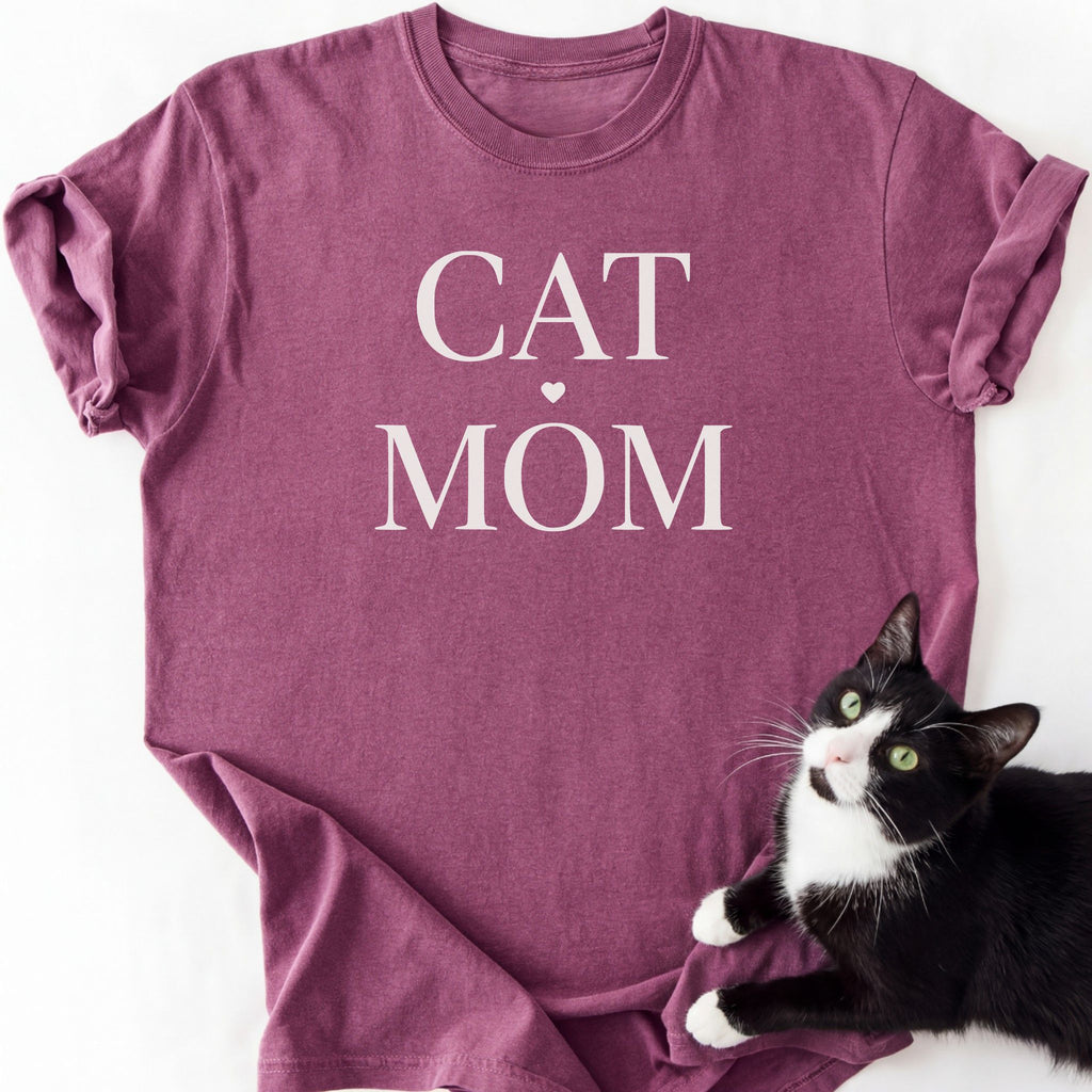 Maroon cat mom t-shirt with "Cat Mom" white serif text and heart — garment-dyed cotton
