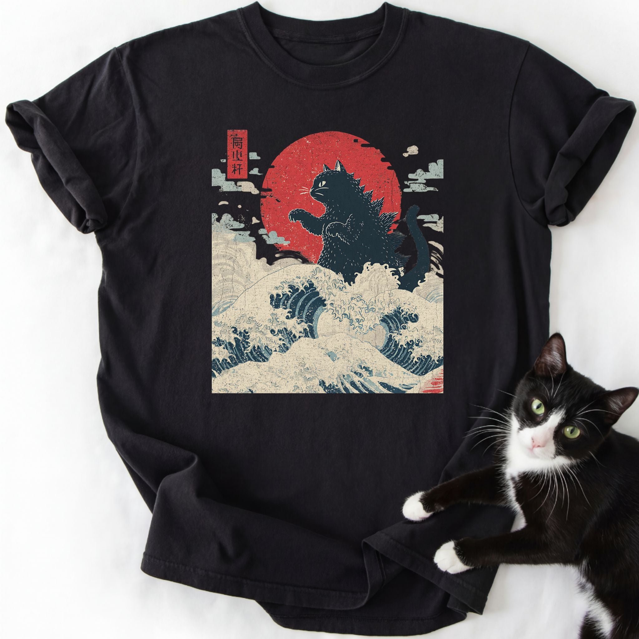 Black Giant Cat Japanese Wave T-Shirt showing black cat standing on blue ocean waves