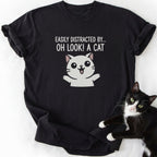 Black Oh Look Cat graphic tee with white cartoon cat and 'Easily Distracted' slogan