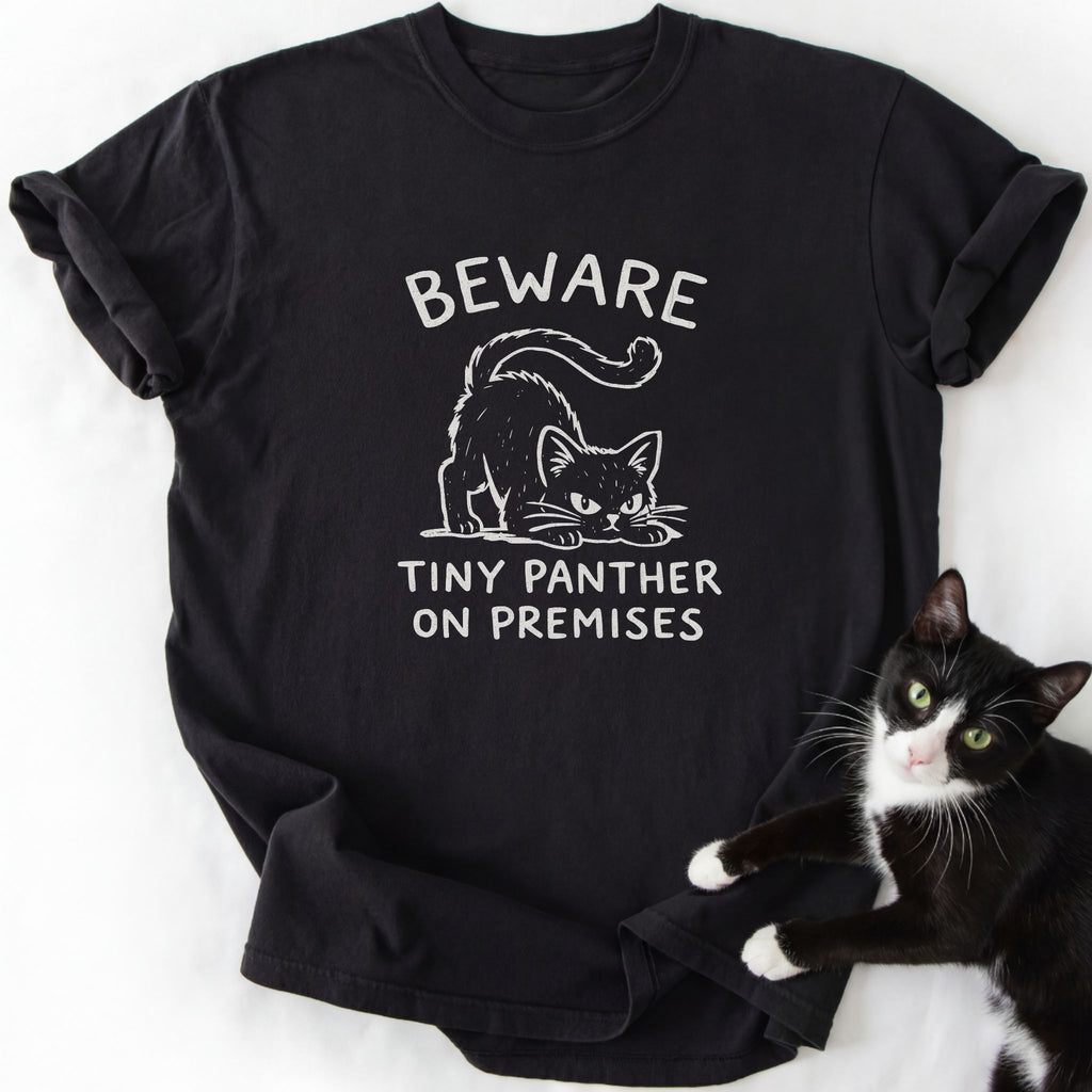 Black short sleeve t-shirt with white crouching cat print and 'Beware Tiny Panther' message