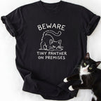 Black short sleeve t-shirt with white crouching cat print and 'Beware Tiny Panther' message