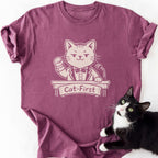 Maroon Cat-First graphic tee with cartoon cat in suit at podium