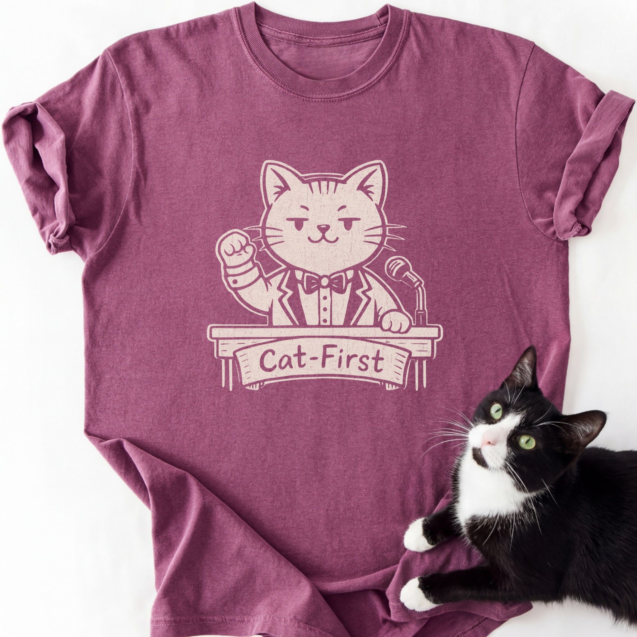 Maroon Cat-First graphic tee with cartoon cat in suit at podium