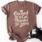 Brown 'Owned By a Cat' graphic tee for cat moms and dads