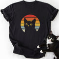 Retro black cat sunset graphic tee in black with yellow eyes