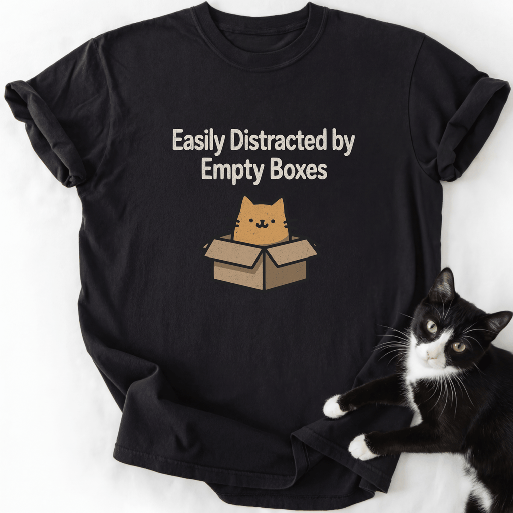 Black cat lover t-shirt featuring tan cartoon cat in cardboard box and humorous quote