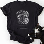 Black cat lover t-shirt featuring bowed head tabby kitten and 'I'm Not Available' slogan