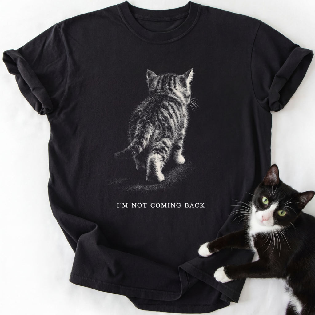 Black I'm Not Coming Back graphic tee with walking kitten design and double-needle stitching