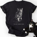 Black I'm Not Coming Back graphic tee with walking kitten design and double-needle stitching