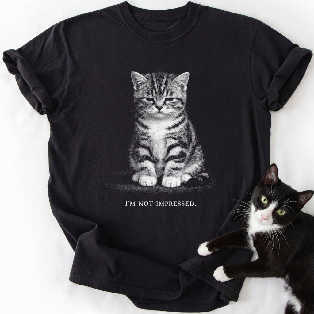 Black I'm Not Impressed cat graphic tee with seated tabby kitten design