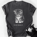Dark gray garment-dyed t-shirt featuring droopy kitten graphic and 'I'm Not Feeling It' text