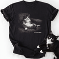 Black short sleeve tee featuring relaxed fit cat in armchair design and humorous quote