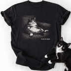Black short sleeve tee featuring relaxed fit cat in armchair design and humorous quote