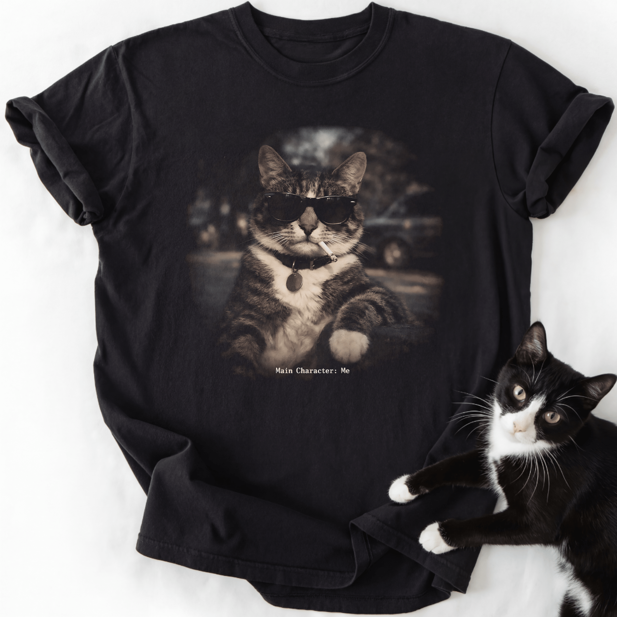 Black vintage cat graphic tee with 'Main Character Me' text and sunglasses tabby design