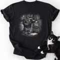 Midnight Newsstand T-Shirt with noir tabby cat graphic and real black-and-white cat